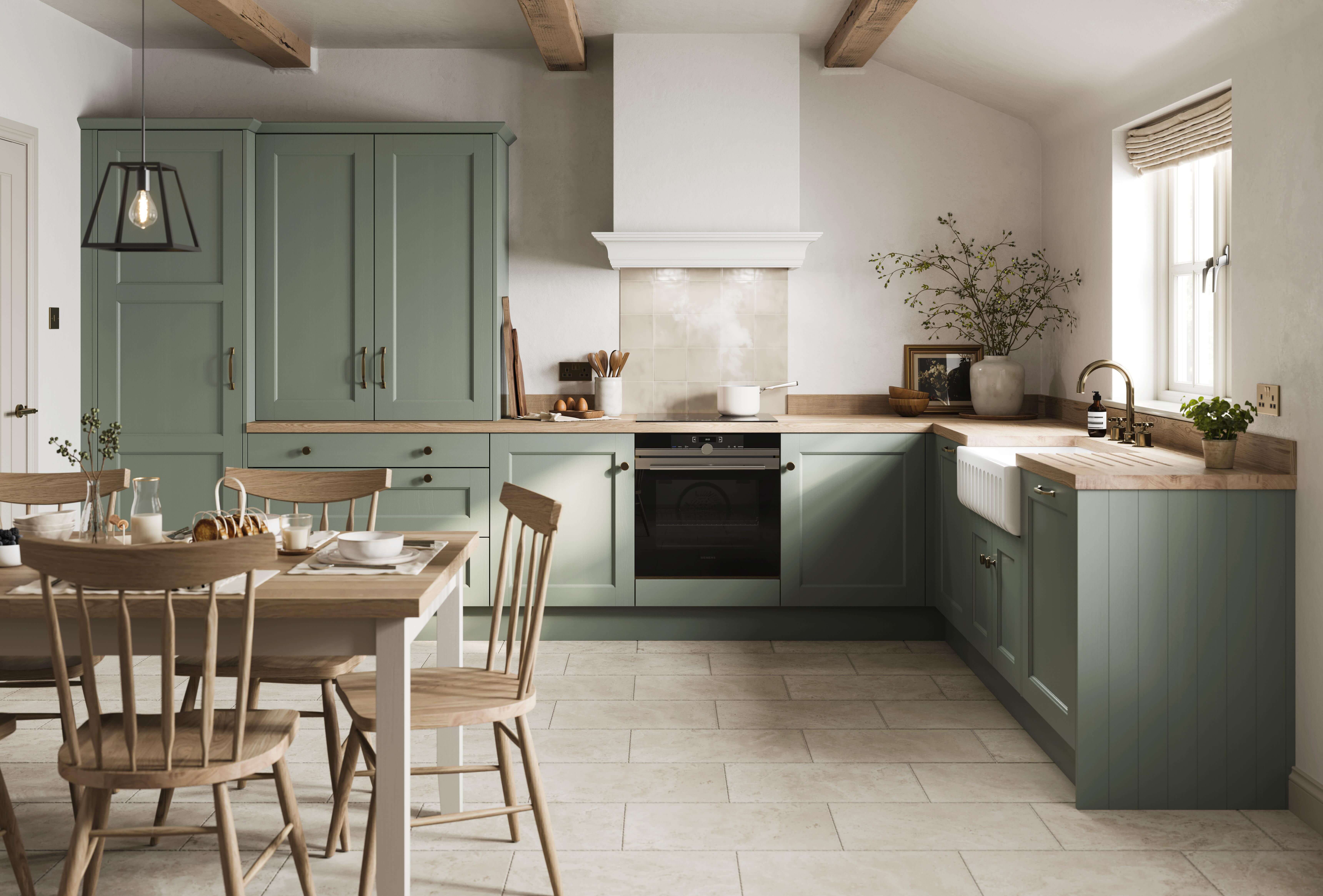 l shape shaker kitchen in reed green with oak work top and dining table
