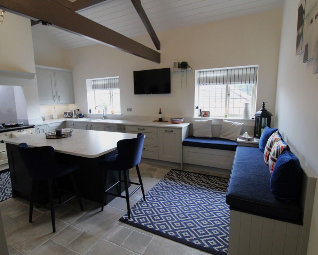 Bench seating with blue velvet seating cushions in kitchen