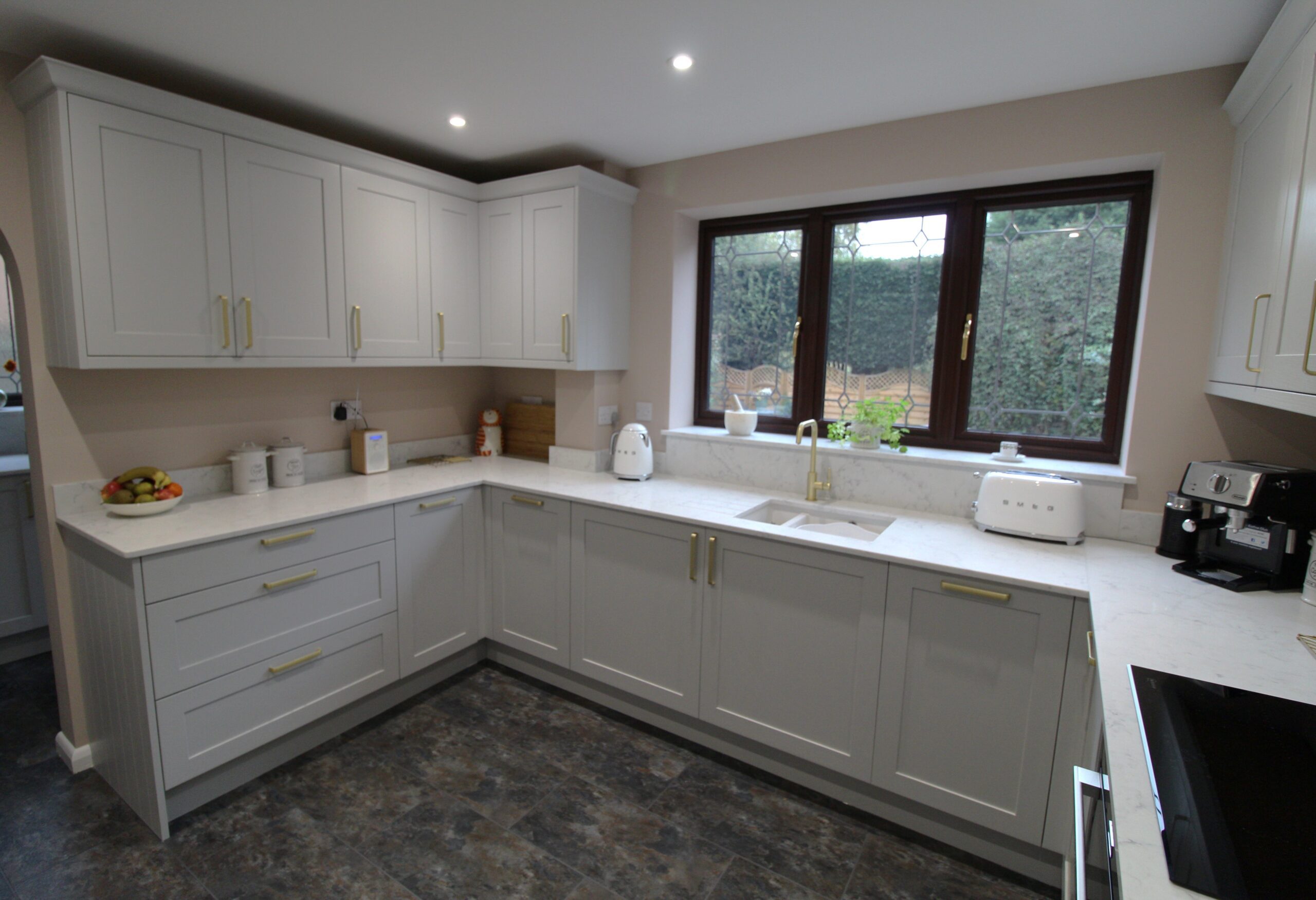 grey shaker kitchen with white quartz worktop