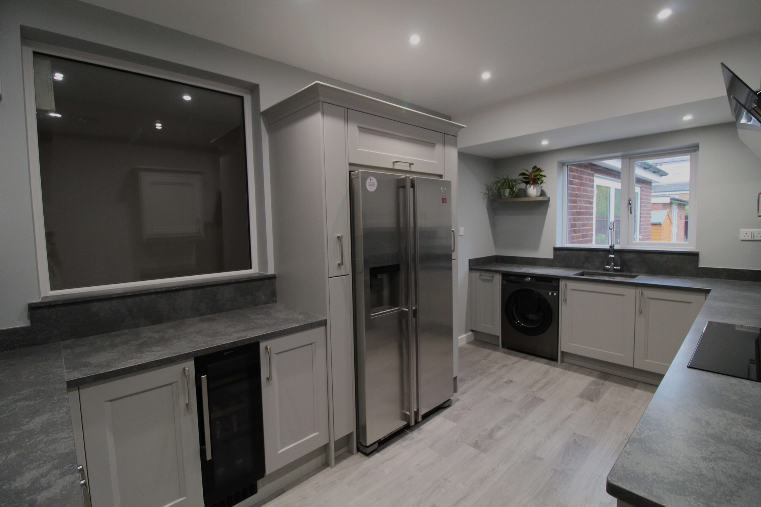 soft grey shaker kitchen with concrete quartz worktop