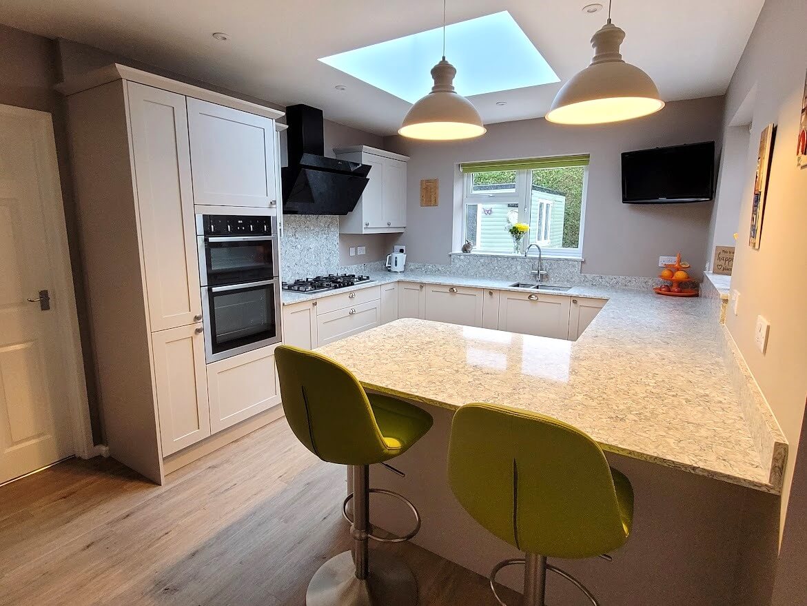 Painted shaker kitchen in cashmere with montclair quartz worktop