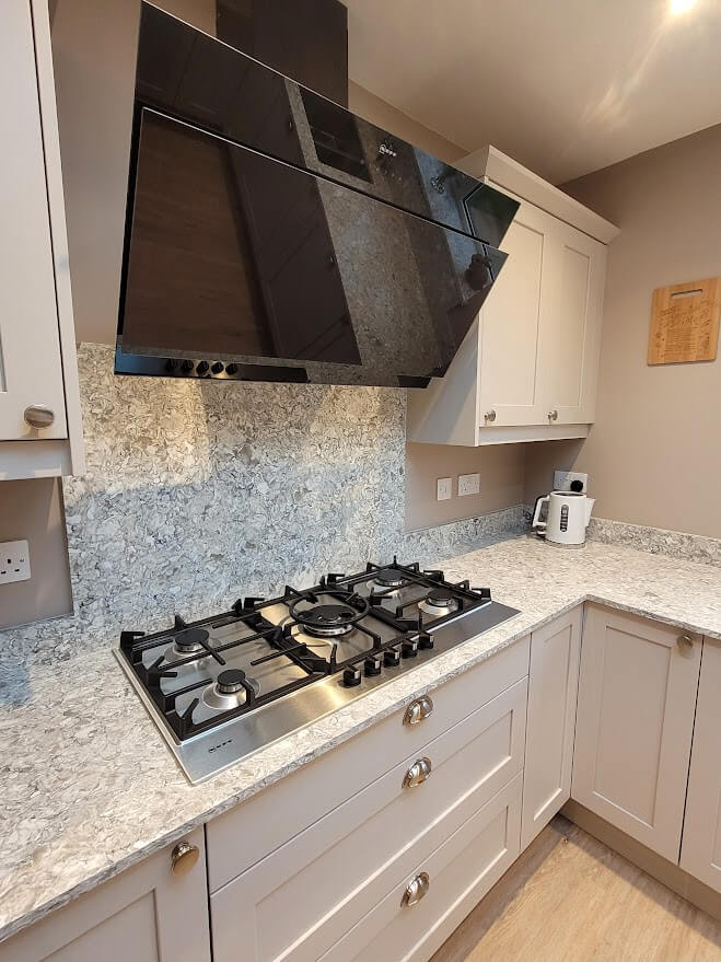 Painted shaker kitchen in cashmere with montclair quartz worktop