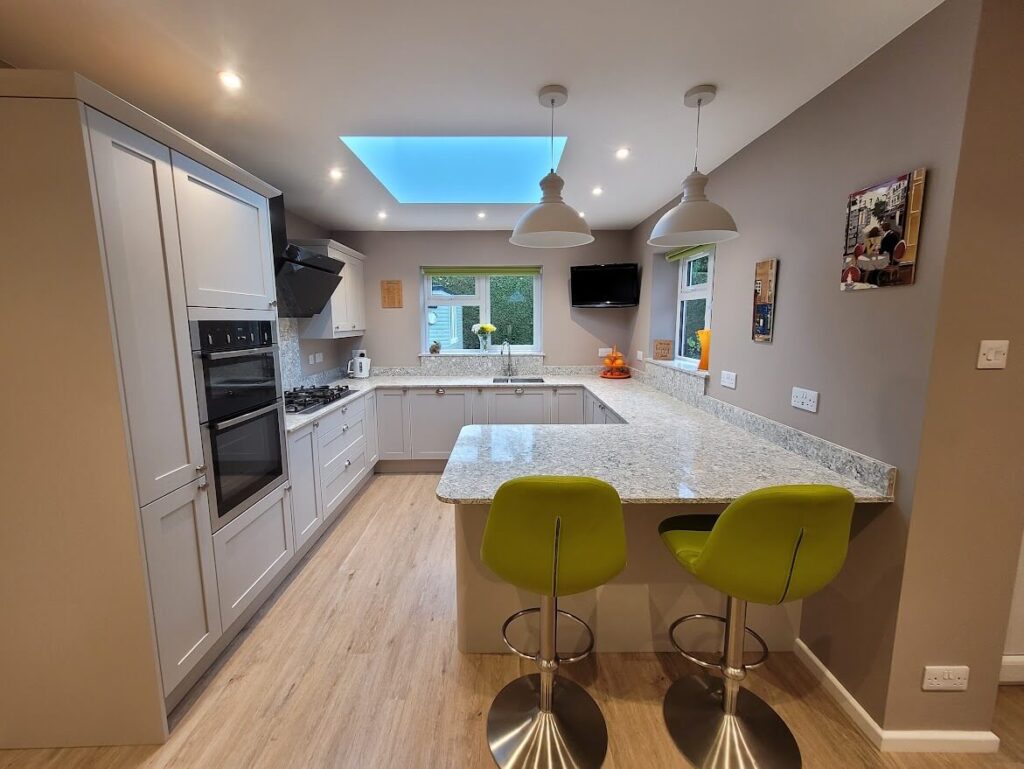 Painted shaker kitchen in cashmere with montclair quartz worktop