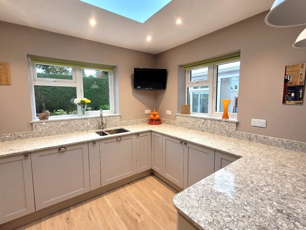 Painted shaker kitchen in cashmere with montclair quartz worktop