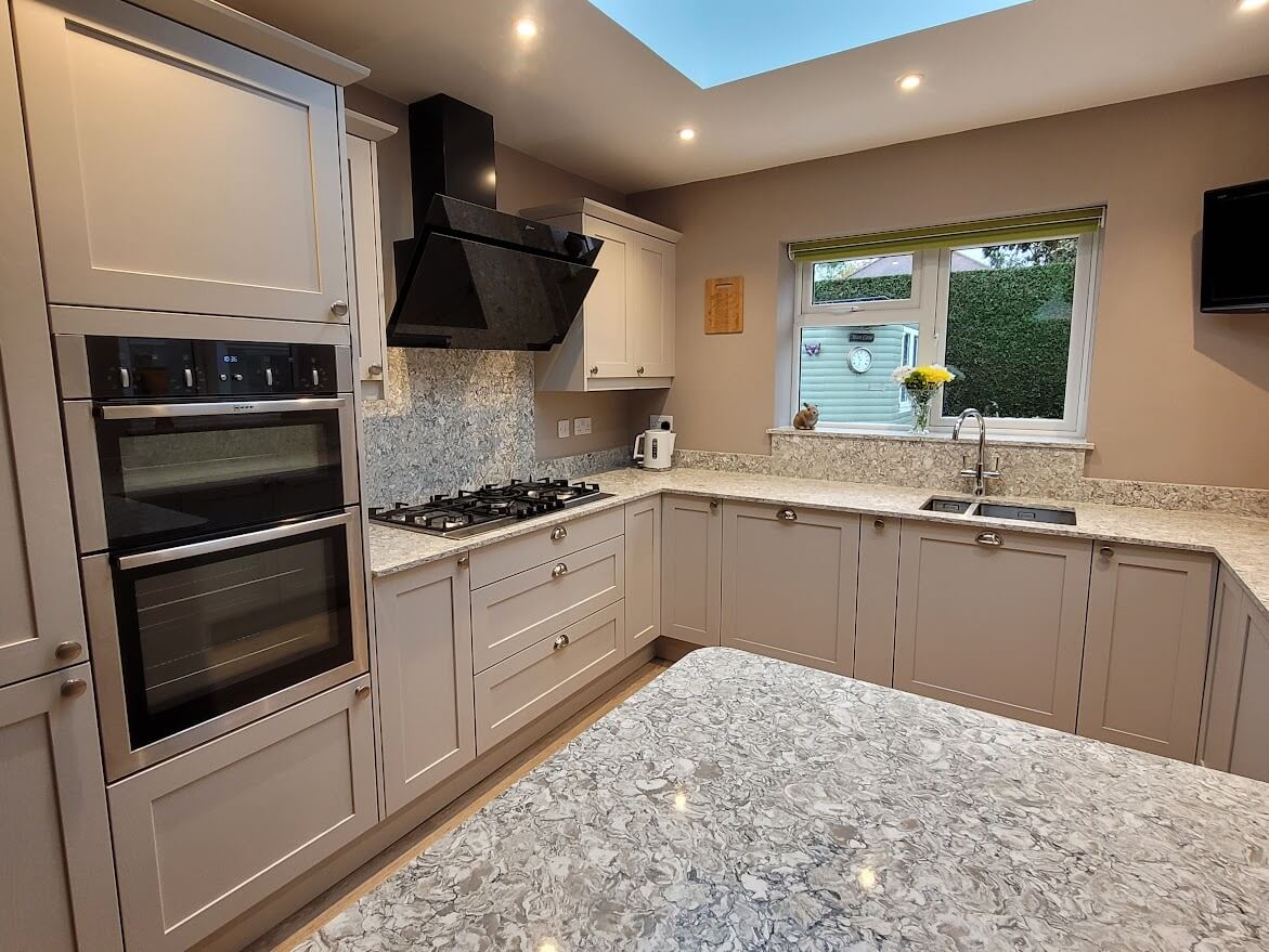 Painted shaker kitchen in cashmere with montclair quartz worktop